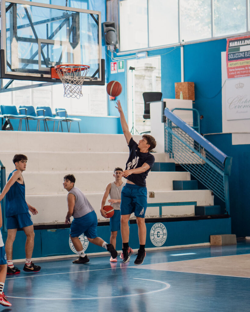 A player performing a lay-up at the Transforming Basketball camp in Italy. Corzek provide social media direction for Transforming Basketball.